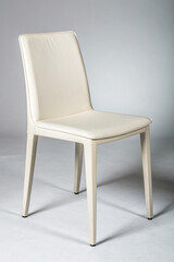 Obraz premium Cream leather dining chair image