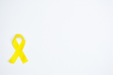 Yellow ribbon symbol. Suicide prevention day, Bladder, Sarcoma, Bone and Bladder Cancer Awareness Month. Yellow ribbon for World Cancer Day and Health Care awareness month
