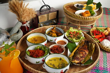 Traditional Malaysian cuisine beautifully arranged with colorful side dishes, fresh herbs, spicy sambal, and decorative presentation that reflects the rich Malay food heritage.