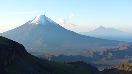 Fototapeta premium Stratovolcano image showing symmetrical cone with snow?capped peak and craters visible from distance surrounded by volcanic rock formations and greenery in Photo Stock Concept and empty space on th