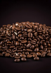 Pile of Roasted Coffee Beans, Rich, Representing Coffee Culture, Against a Dark Backdrop