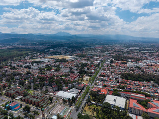 Fototapeta premium Aerial photograph of Xochimilco ecological zone in Mexico City, a day with clouds and a summer sun over wetlands to south of city