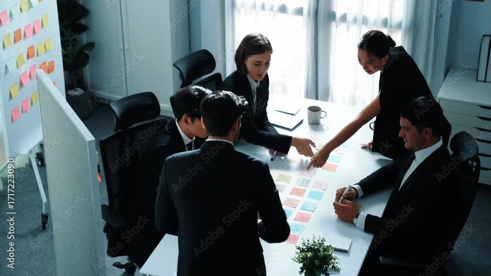 Aufkleber top view of businessman explain marketing strategy and choose idea by using colorful stick notes. pr