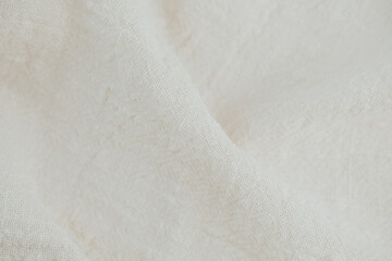 Draped cotton fabric in cream white for fashion design or branding backgrounds