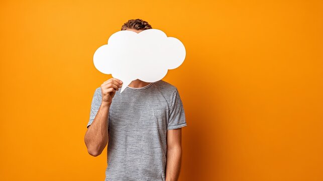 A man is holding a white paper that looks like a cloud