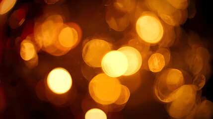 Warm golden bokeh lights against a dark background.
