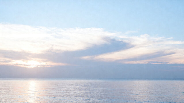 Sunset over calm ocean with soft clouds and reflective water surface