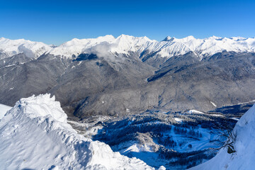 Snow-Capped Mountain Range under a Clear Blue Sky