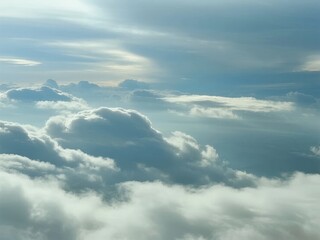 Obraz premium Aerial view of dense cloud formations under a partly cloudy sky