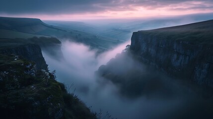 Fototapeta premium A misty valley at dawn, layers of fog rolling between jagged cliffs, soft pastel skies, atmospheric landscape photography
