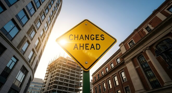 Urban Transformation: "Changes Ahead" Sign Amidst Modern Architecture and Construction, Sunny Outlook