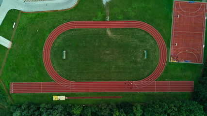 Aerial view of running track and sports field complex