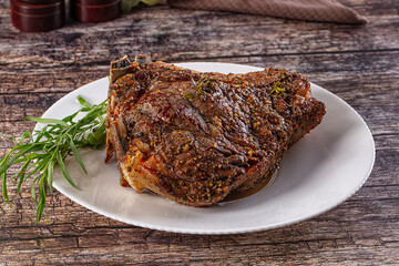 Baked beef steak on the bone