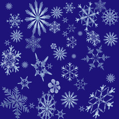 falling blue transparent snowflakes of different sizes on a blue background.Close-up, isolated2