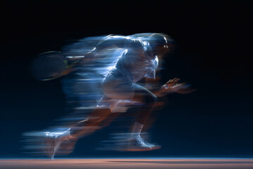 Tennis Player in Action Serve Isolated on Dark Background