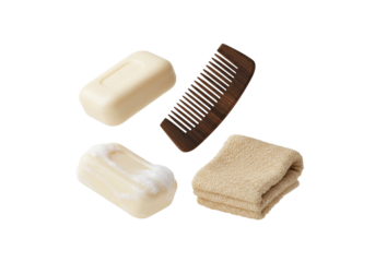 Soap, Comb, Towel, and Washcloth on Soft Background