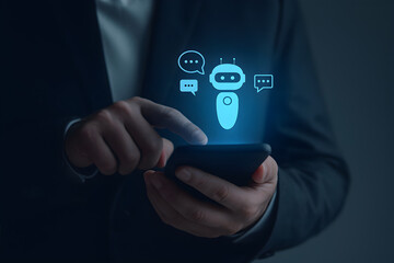 A person in a suit uses a smartphone with a glowing chatbot icon and speech bubbles, symbolizing AI-powered communication and customer service.
