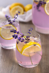 Summer homemade lemonade with lavender syrup, lemon juice and sparkling water with lavender sprigs