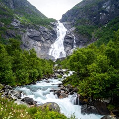 Majestic Waterfall Cascading Through Mountains.