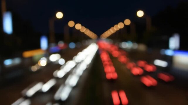 A bustling city street at night with blurred lights