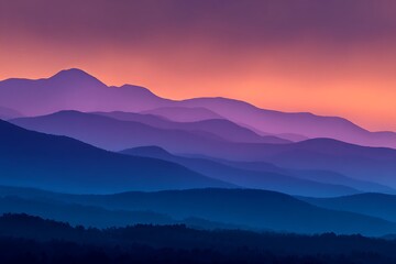 Obraz premium A breathtaking vista of layered mountain ranges, bathed in a spectrum of purples and blues at sunrise.