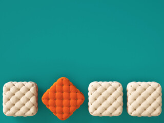 Orange pouf among ivory ones on green-blue background with copy space