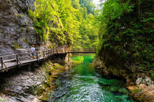 Hiker strolling along the walkways of the stunning scenery of the Vintgar Gorge, Slovenia.