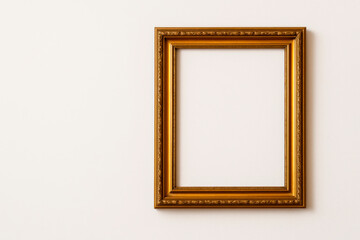 An empty gold frame for the picture. Space for text.