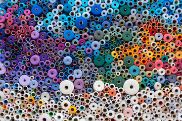 coloured threads wound onto spools