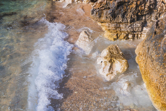 Ocean Waves Crashing Rocky Coastline Golden Limestone Cliffs