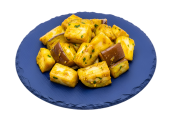Seasoned eggplant cubes, golden-yellow and deep-purple, arranged on a vibrant royal blue plate, showcasing a delightful blend of textures and colors.