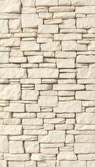 Fototapeta premium Cream colored block wall texture featuring irregular rectangular stones, ideal for backgrounds and modern construction applications