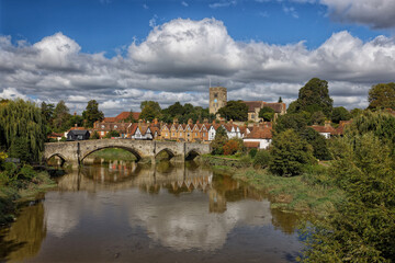 Fototapeta premium The Bridge over the river Medway and the Church of St Peter and St Paul's and the village of Aylesford Kent England UK