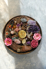 wiccan witch altar. moon amulet, talismans, crystal gemstones, floral candles, witchery stuff on table. Magic, witchcraft. esoteric ceremony, spiritual ritual for relax, meditation. top view
