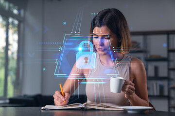 Woman working on cybersecurity with digital lock interface overlay indoors.