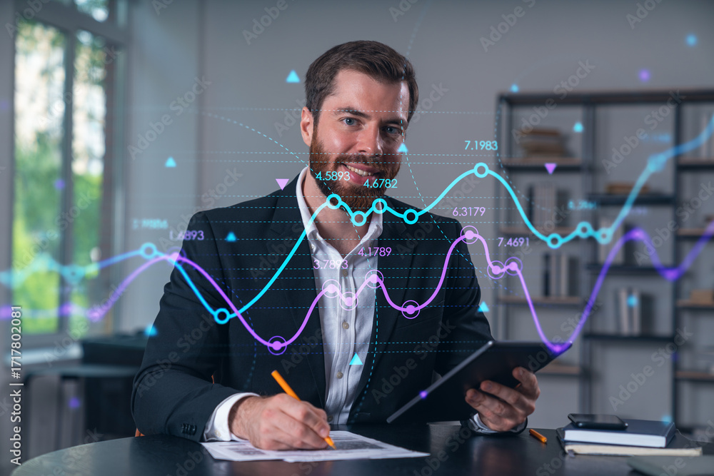 Poster man analyzing financial data with digital graphs overlay in modern office setting.