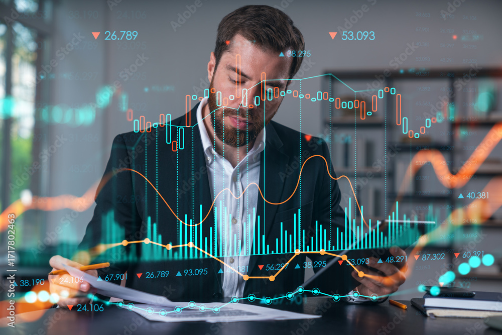Poster man analyzing financial data with digital stock market graphs overlayed on screen.