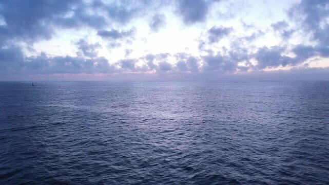 Drone shot tilt down on the sea