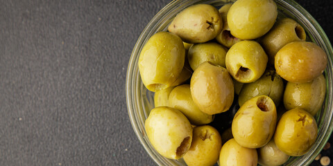 Green olives pickled seedless natural product tasty snack fresh delicious gourmet food background on the table rustic top view copy space