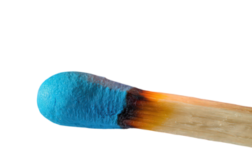 Closeup of a Partially Burnt Matchstick with Blue Tip Against Black Background