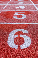 Running track with numbers in the stadium, sport background.