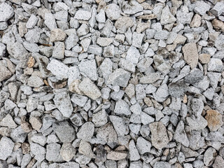 Close-up of white stone gravel. Premium white gravel texture. Gravel surface for commercial design. Stone gravel texture background. High resolution gravel stones. Close-up gravel surface for design