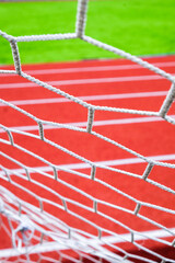 Soccer goal net on the sports field. Selective focus.
