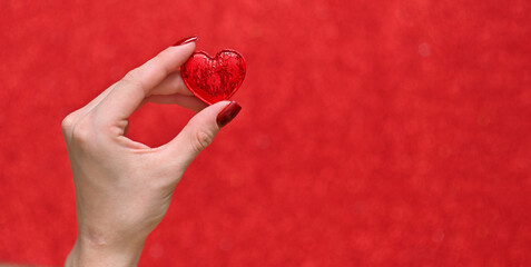 A heart in her hands on the background
