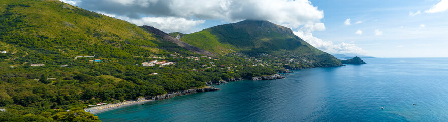 Fototapeta premium Aerial view of the coast of Lucania near Maratea, in the province of Potenza, Basilicata, Italy. The blue waters of the Tyrrhenian Sea extend to the horizon.
