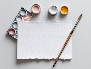 Art Supplies Still Life: Paint, Brush, and Paper.