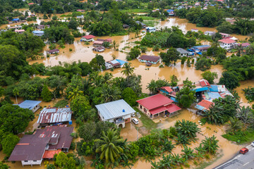 Aerial view of a flood in Penampang, Sabah, Malaysia. Overflowing river causes severe flooding,...