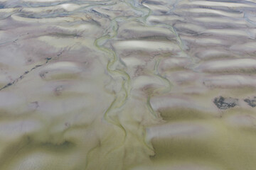 Low tide exposes shallow sand banks in Cape Cod Bay, just off Skatet Beach, Orleans, Massachusetts. This shallow sand habitat is a feeding ground for birds in the area.