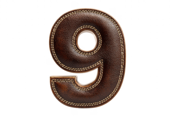 Detailed leather crafted number nine isolated on a black background close up shot