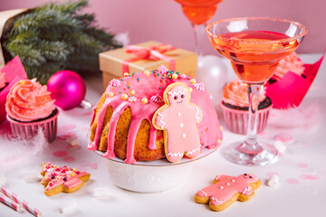 Pink Christmas fruit cake pudding. Winter homemade baking. Festive table.